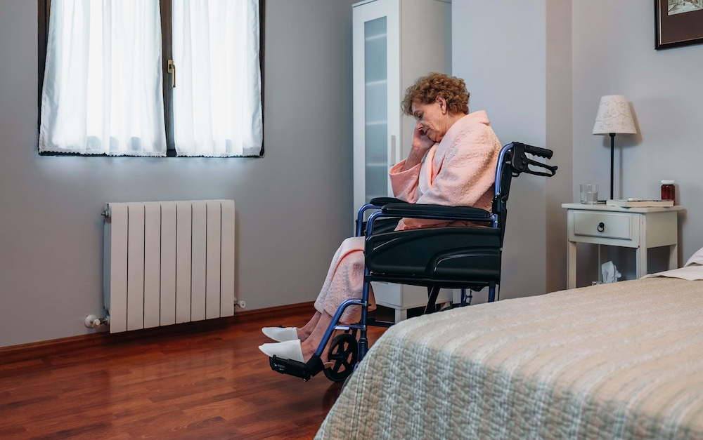 Senior woman in a wheelchair alone