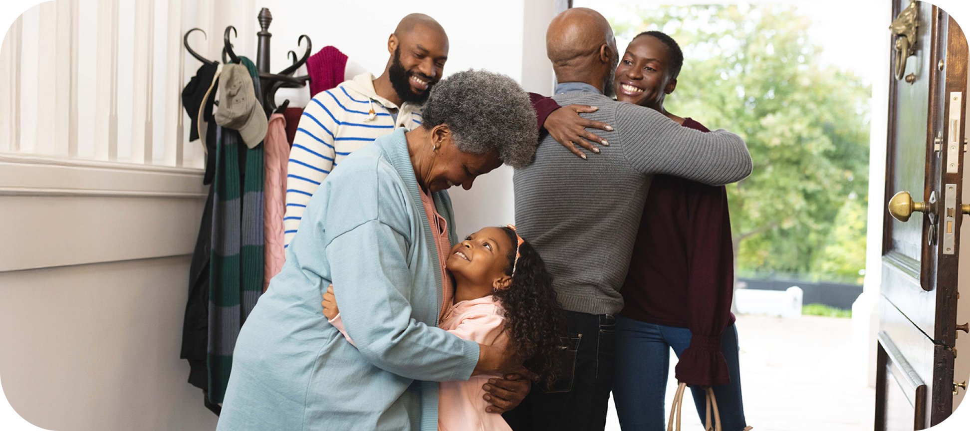 a family greeting each other happily